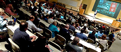 Audience and speaker at the Texas GIS Forum